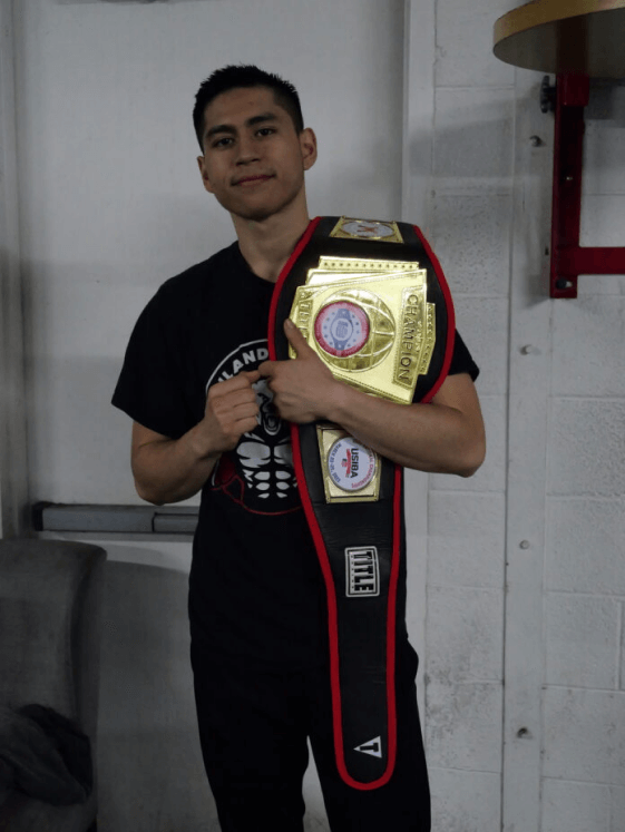 Benjamin Perez holding a championship belt